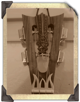 Haunted Mansion inspired Banjo Uke headstock by Tiki King, from: www.tikiking.com