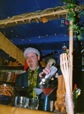 Tiki King pouring a drink