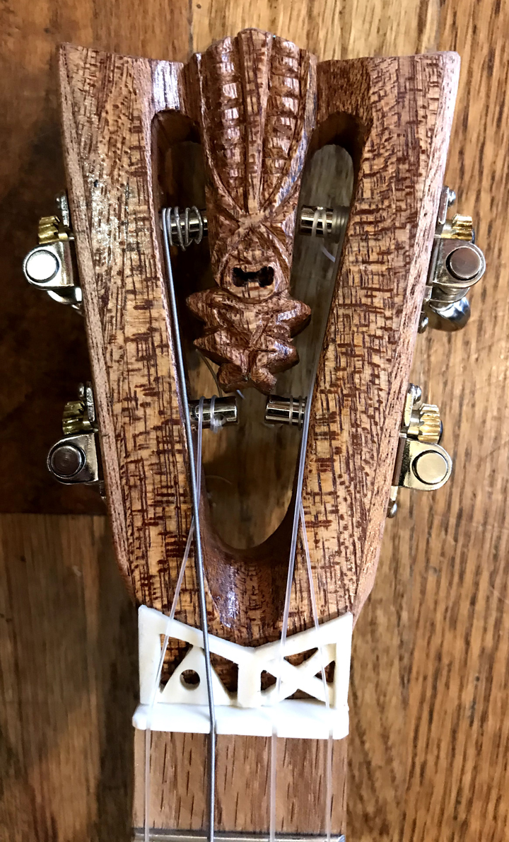 Tiki King small world inspired Banjo Uke #2 headstock by Tiki King, from: www.tikiking.com