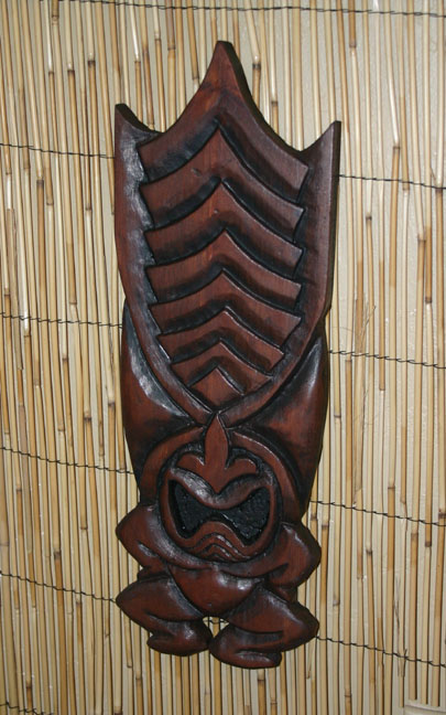 stylized Ku wall carving by Tiki King