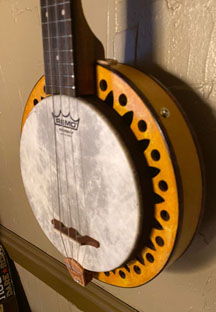 tahitian sun god tiki inspired Banjo Uke detail