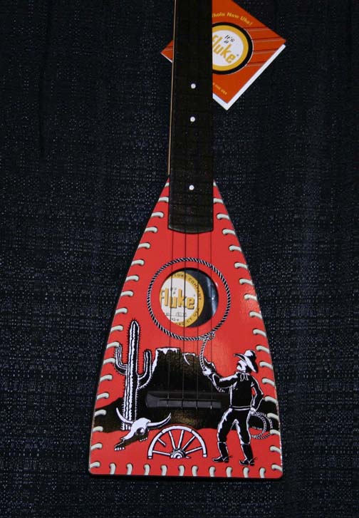 The Red Cowboy Fluke Ukulele by Tiki King at the NAMM Show January 16th-19th 2008 in Anaheim, CA.